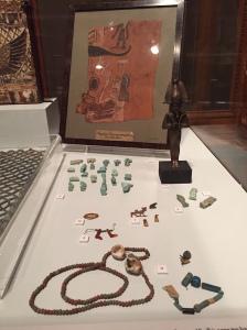 Amulets, jewellery, and a statuette of Osiris, god of the Dead, associated with burials. Two Temple Place